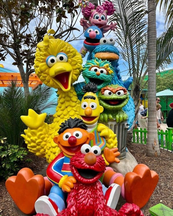 Several Sesame Street characters lined up in a fun stature, featuring fan favorites like Big Bird, Elmo, and Bert and Ernie.