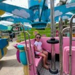 A young girl rides on one of the thrilling rides at Sesame Place San Diego.
