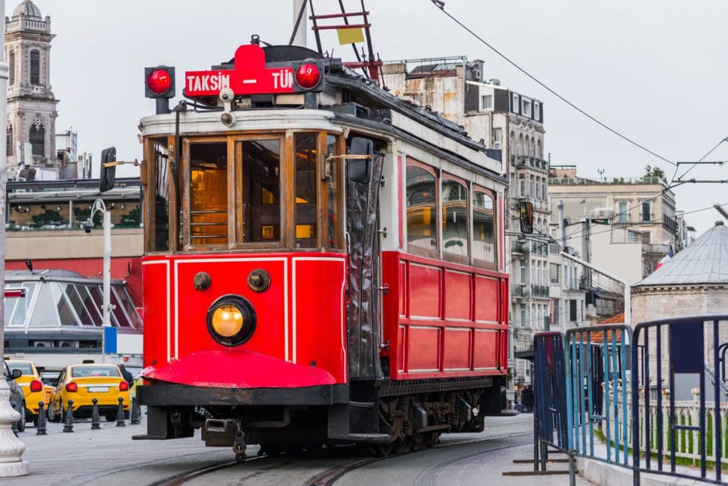 A close up of the Nostalgic Red Tram, parked along the tracks.