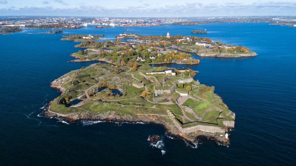 An aerial view of the Suomenlinna Sea Fortress, surrounded by water, a must stop on our Finland winter itinerary for families.