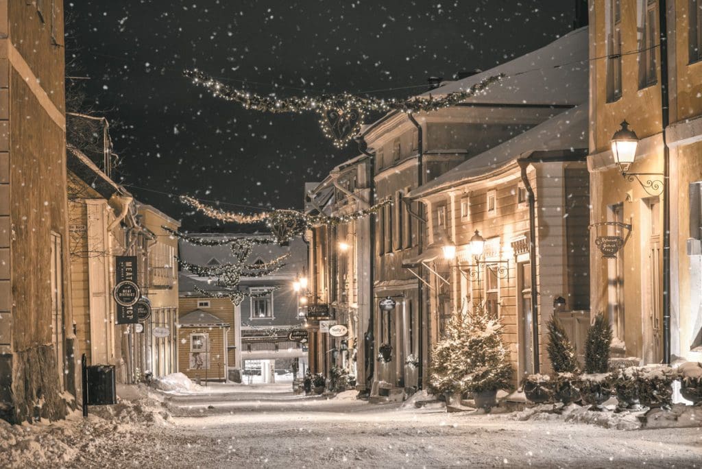 A magical winter wonderland along a street in Porvoo, lit up with Christmas lights.