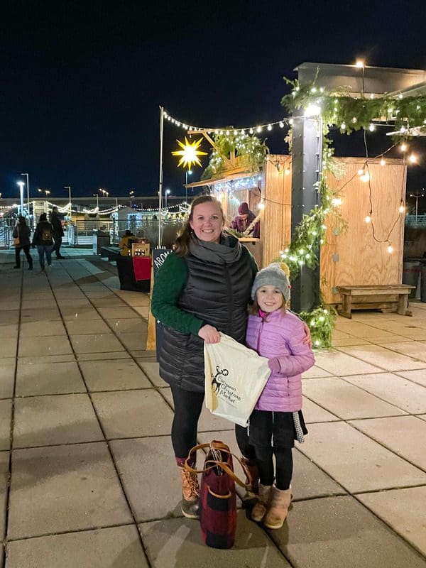 A mom and her young daughter explore the St. Paul European Christmas Market.
