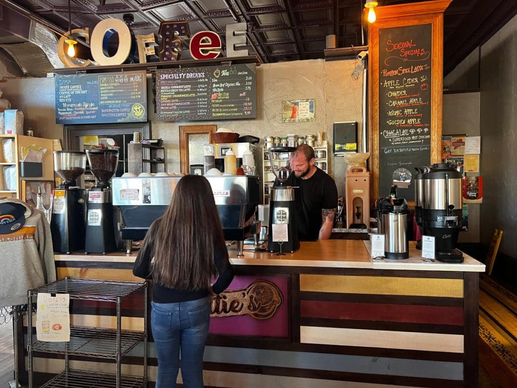 A tween orders a drink from a barista at Dottie's Coffee Lounge in Pittsfield, one of the best places to eat in this weekend getaway itinerary for families in Pittsfield.