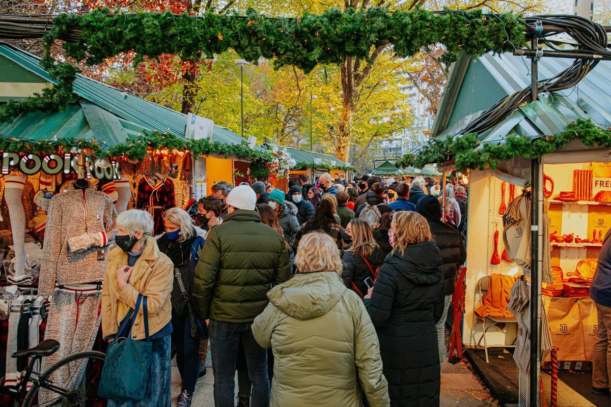 A crowd of people meander through the vendors at Columbus Circle Holiday Market.