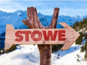 A sign in the mountains reads "Stowe".