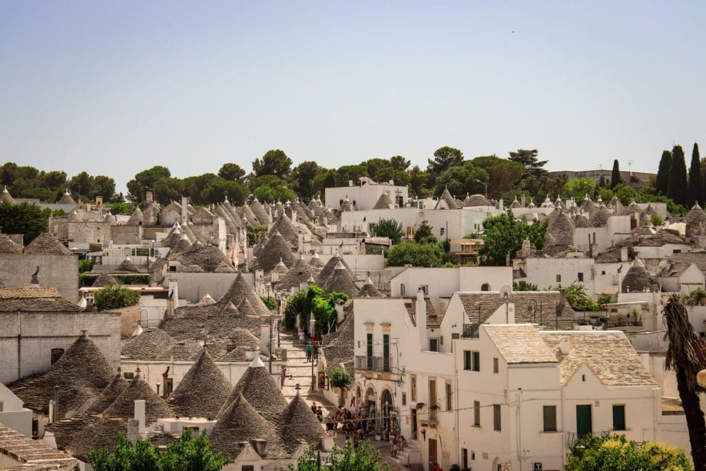 The iconic trulli, conical rooftops, in Alberobello, one of the best places to visit in Puglia with kids.