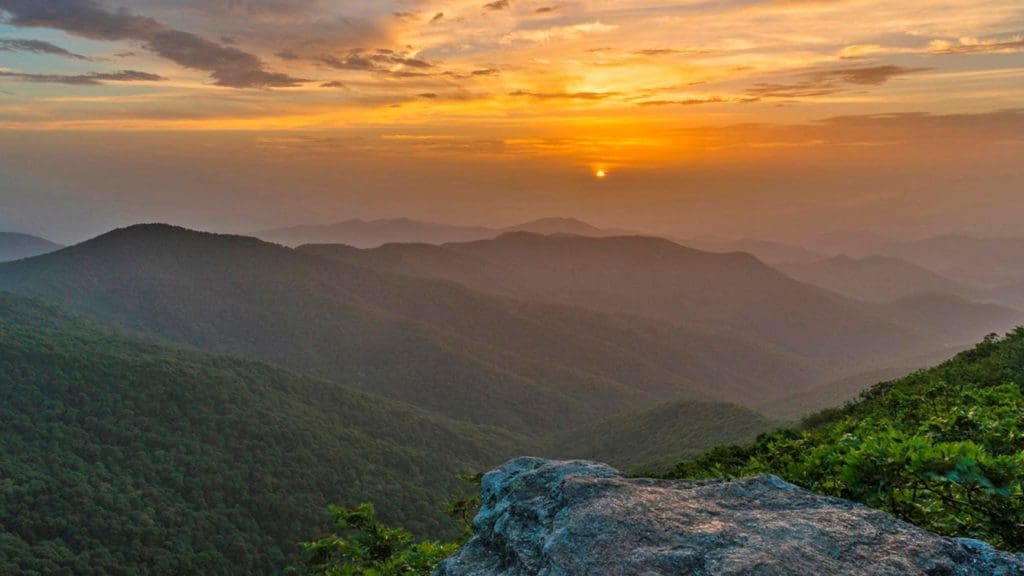 The sunset from Craggy Gardens in the Blue Ridge Parkway, a must stop on any Asheville family vacation itinerary.