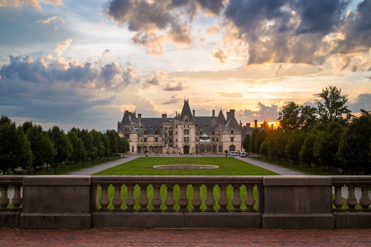 A view of the Biltmore Estate house at dusk, one of the best things to do with kids in Asheville.