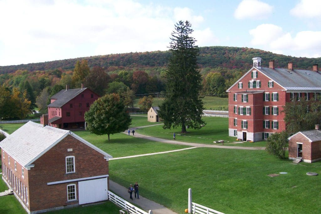 An aerial view of some of the lush grounds and historic buildings at Hancock Shaker Village.