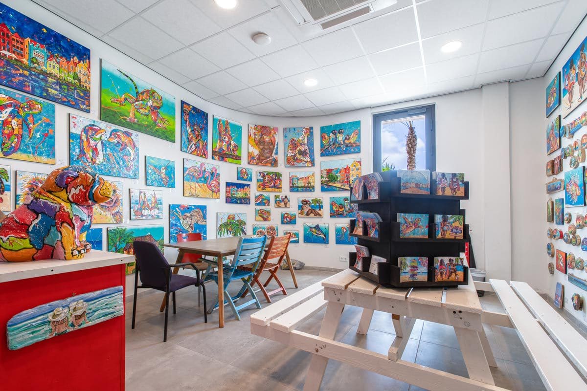 Inside the colorful kids' club, filled with fun books, at Mangrove Beach Corendon Curacao All-Inclusive Resort, Curio Collection.