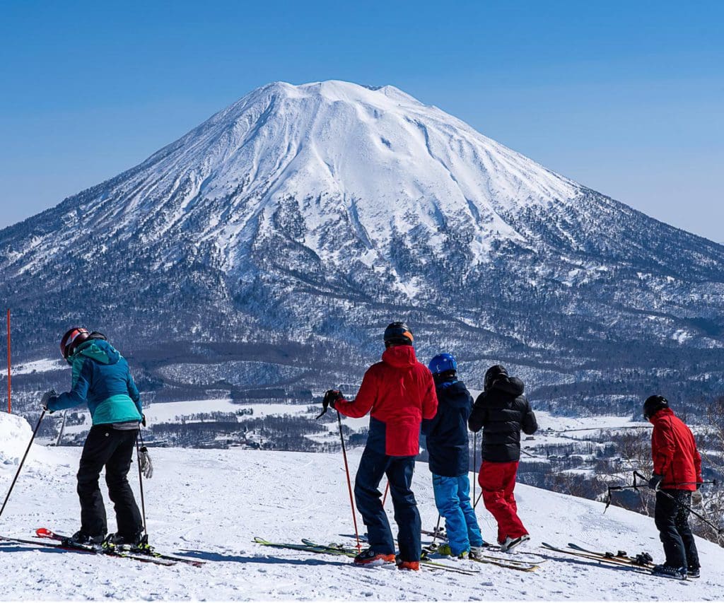 People ski across the snow near Niseko.