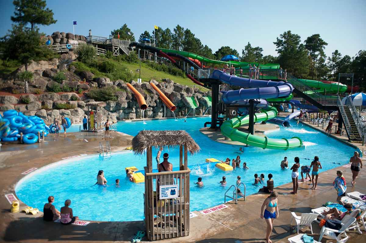 The activity pool filled with young kids on a sunny day at Ocean Breeze Water Park.