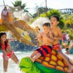 Several kids play at a turtle water feature at Soak City at Kings Dominion.