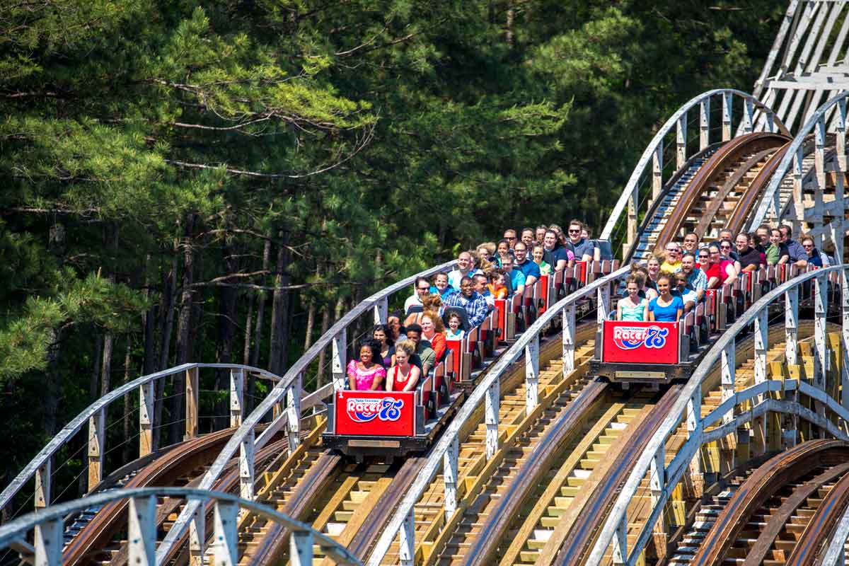 Tandem roller coasters move down side-by-side tracks at Soak City at Kings Dominion.