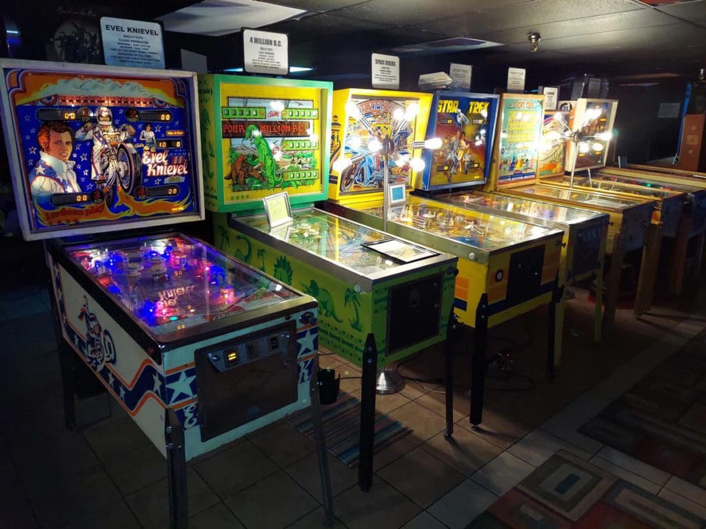 A line of pinball machines at the Asheville Pinball Museum.