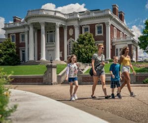 Two adults and two children walk passed the Hunter Museum of American Art in Chattanooga.