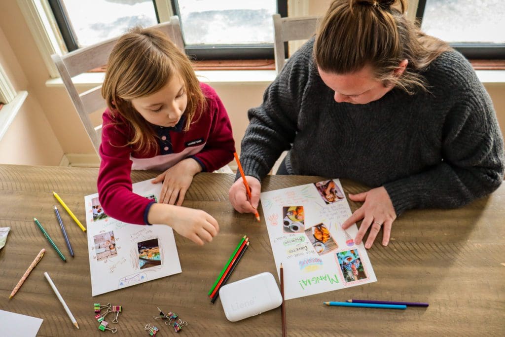 A mom and her young daughter make journal pages from their recent trip to Italy.