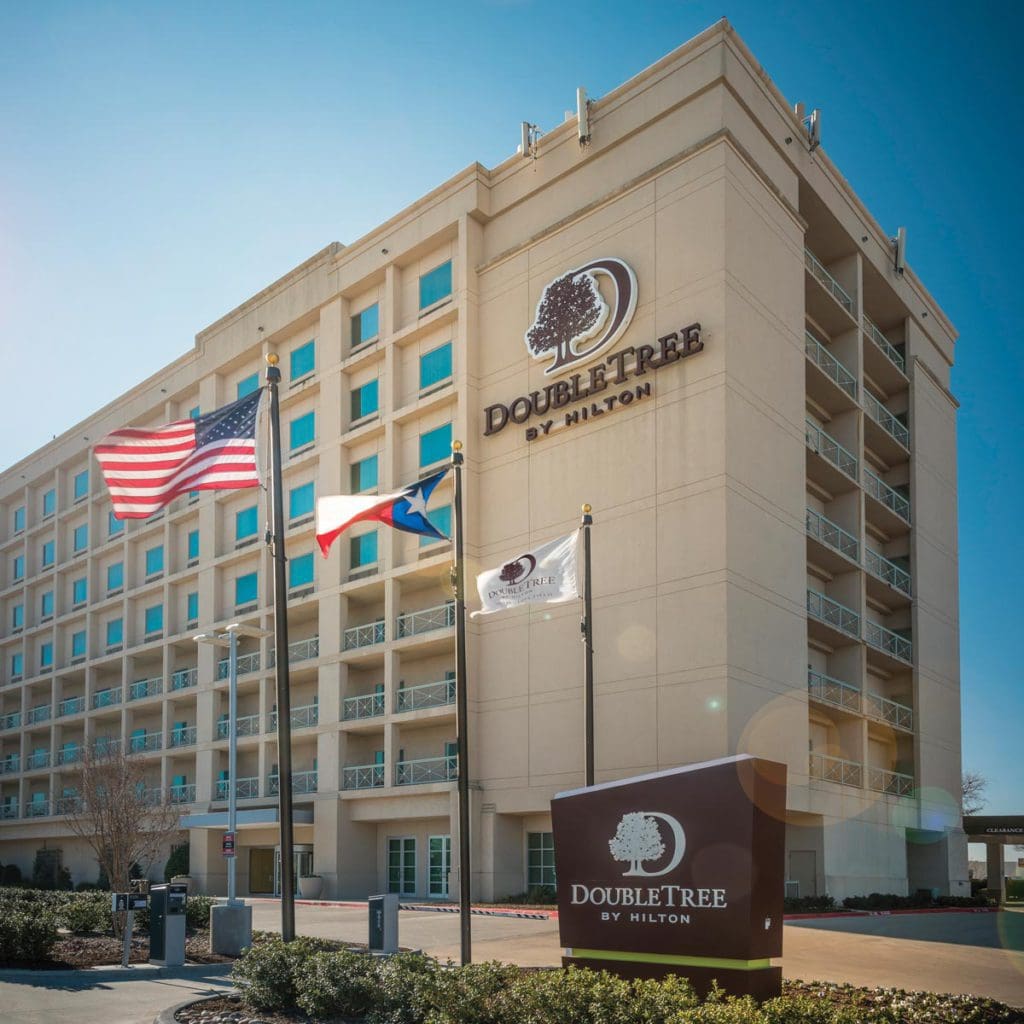 The exterior entrance to The Doubletree by Hilton Hotel Dallas-Love Field, one of the best hotels in Dallas for families.