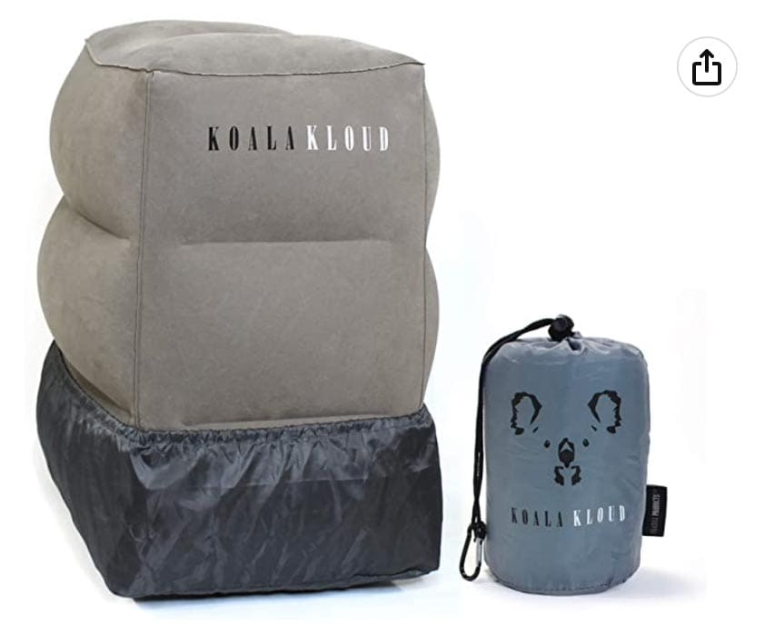 Product shot of a Koala Kloud Travel Foot Rest, blown up and within its carrying case.