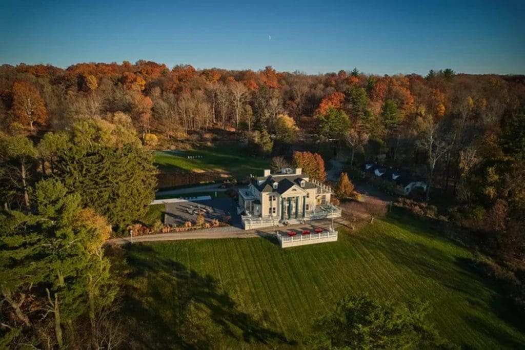 An aerial view of Habitas on Hudson, surrounded by colorful fall foliage.