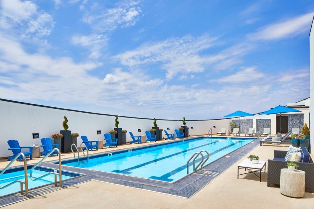 The outdoor pool on a rooftop of Renaissance Dallas Hotel on a sunny day.