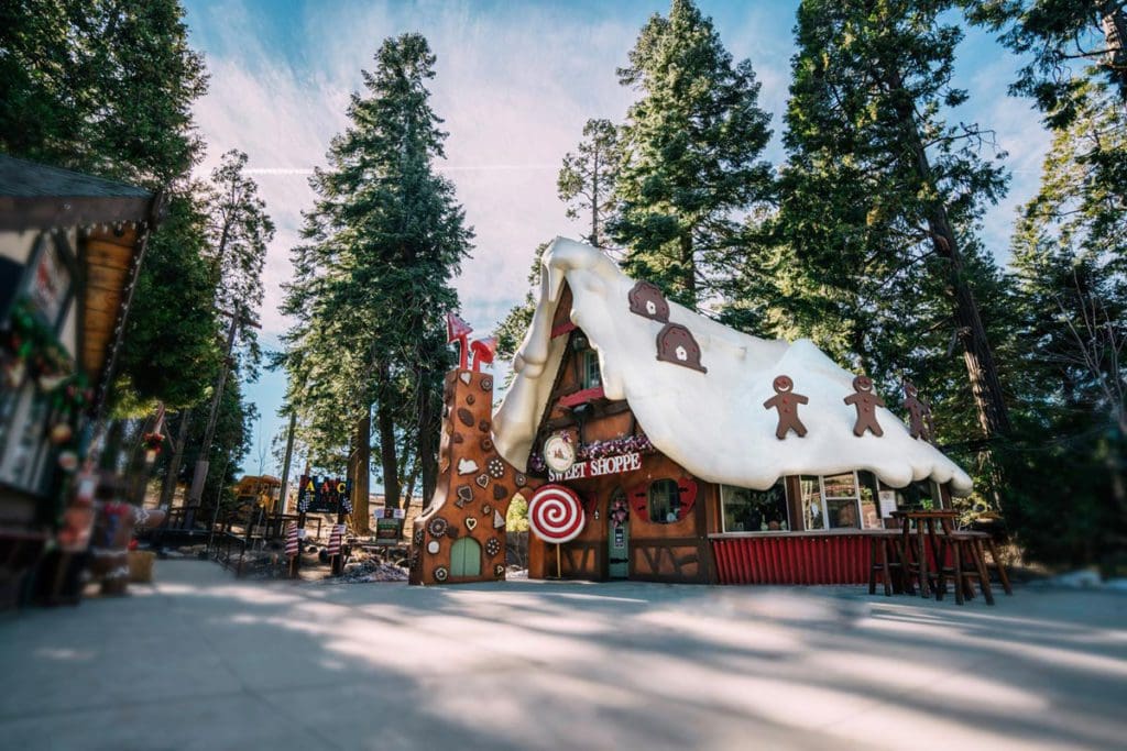 A cozy, gingerbread-inspired buildings at Skypark Santa’s Village during the winter.