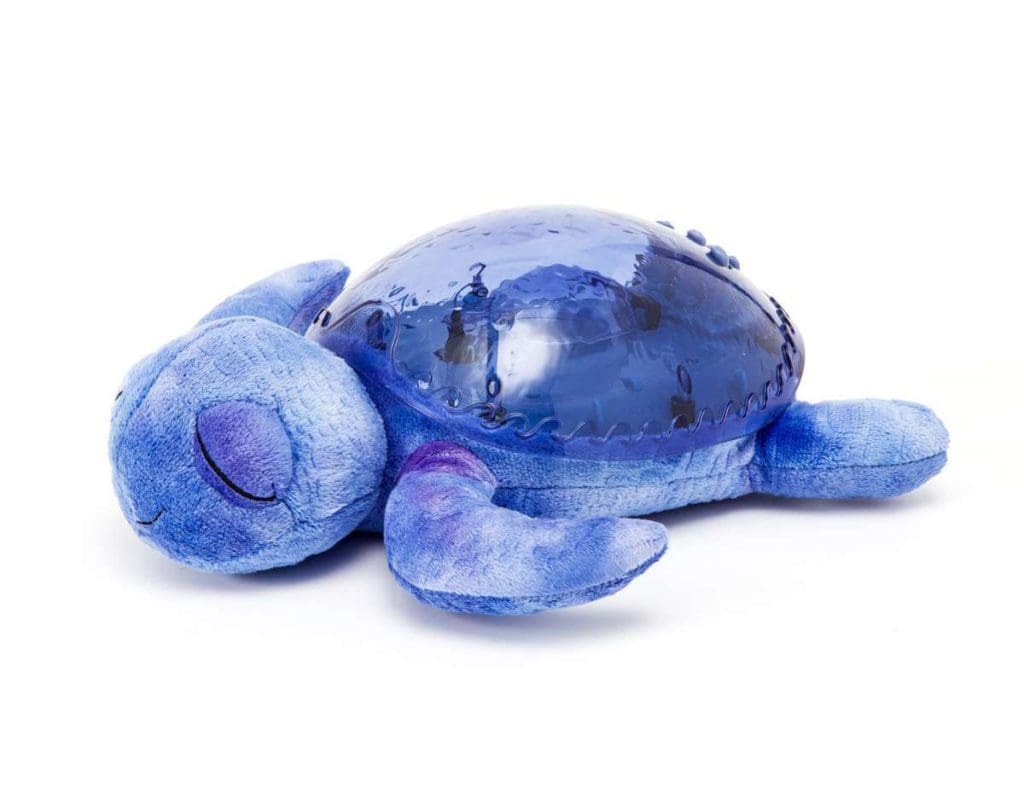 A product shot of the purple Tranquil Turtle, one of the best products for sleeping on long international flights with kids.