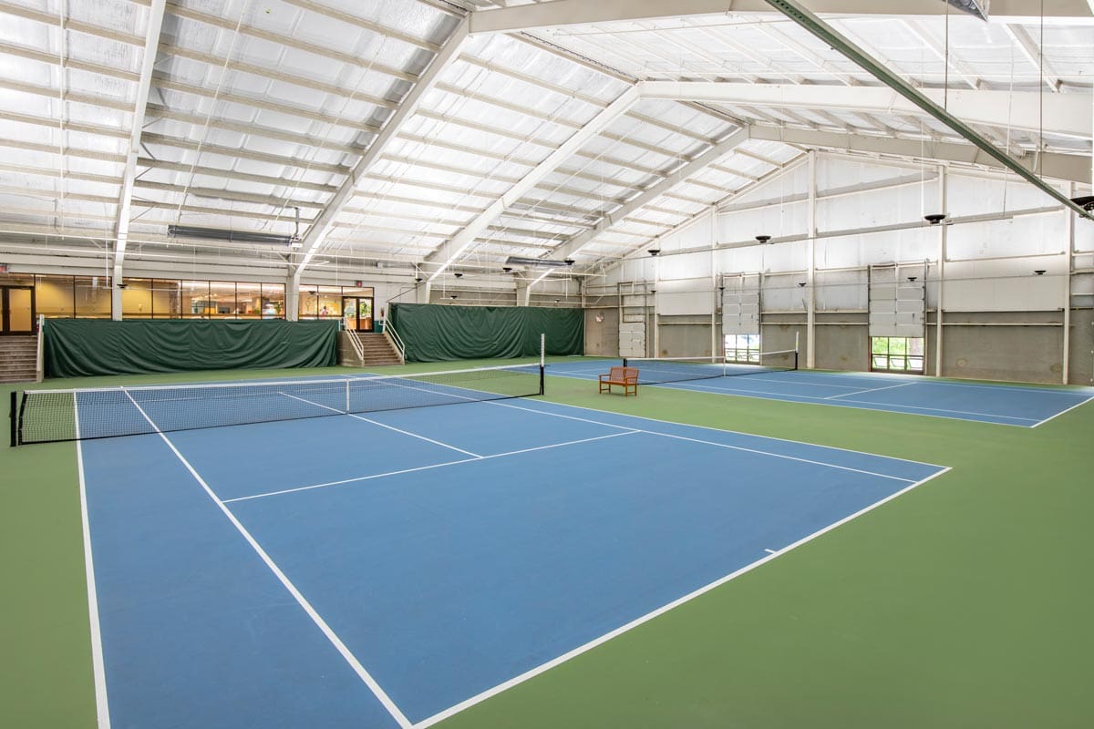 The tennis courts on-site at Omni Grove Park Inn, one of the best hotels in Asheville for families.