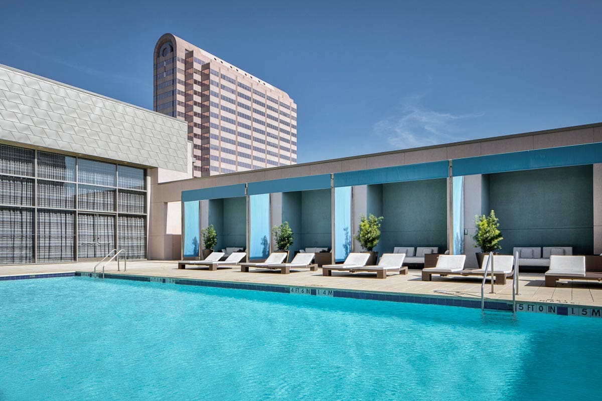 The outdoor pool, with poolside loungers nearby, at The Westin Galleria Dallas Hotel, one of the best hotels in Dallas for families.