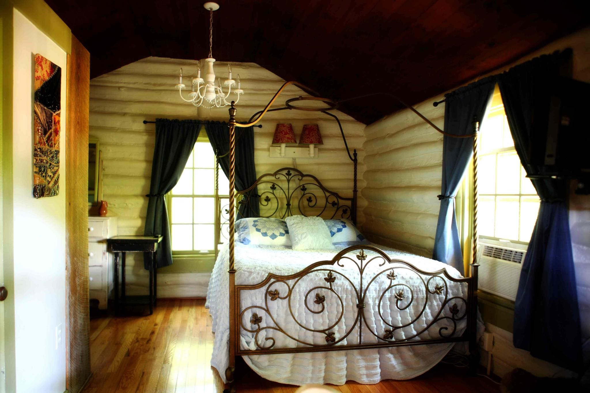 Inside one of the cozy bedrooms of a cabin at The Pines Cottages.