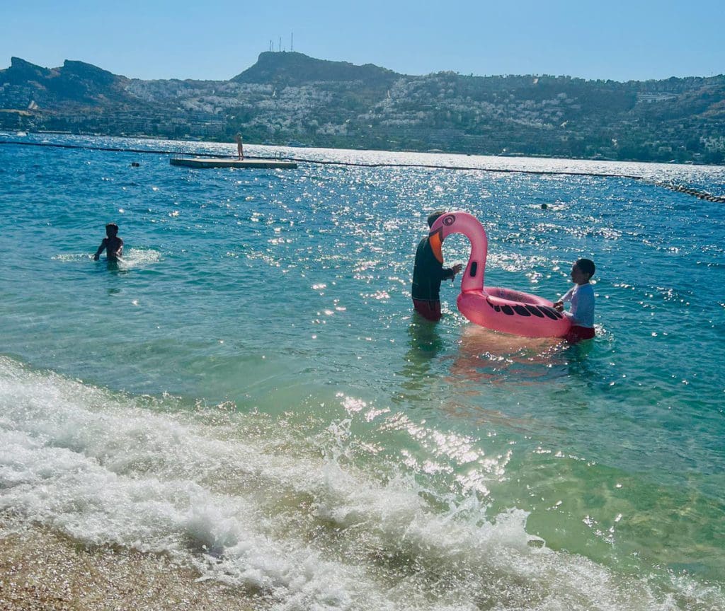 Kids play in the water off-shore from Bodrum in Turkey.