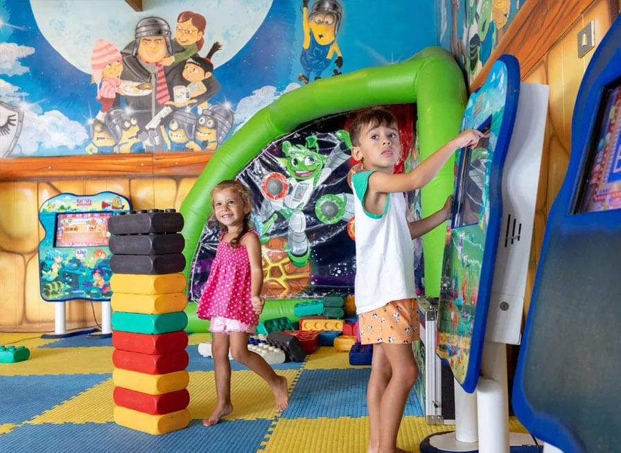 Two kids play in the colorful kids' club at Club Family Hotel Milano Marittima.