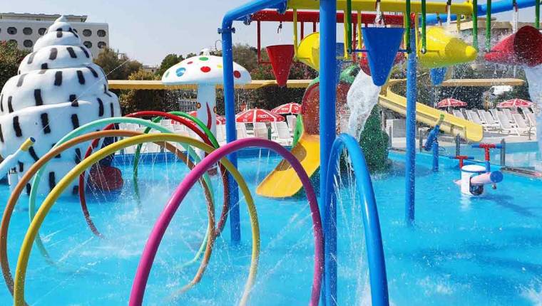 The many colorful outdoor aquapark amenities at Club Family Hotel Serenissima.