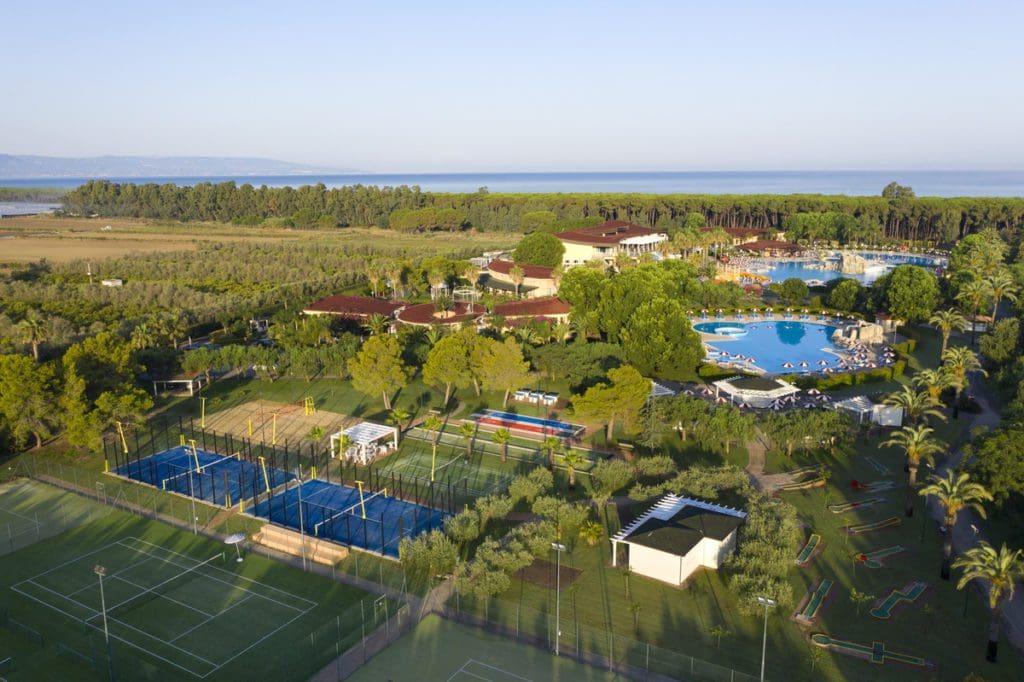 An aerial view of the resort and verdant grounds of Falkensteiner Club Funimation Garden Calabria, one of the best all-inclusive resorts in Italy for families.