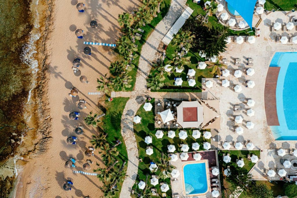 An aerial view of the beach and pool deck at Louis Ledra Beach.