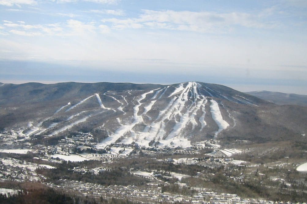 An aerial view of Mount Snow Ski Resort covered in snow.
