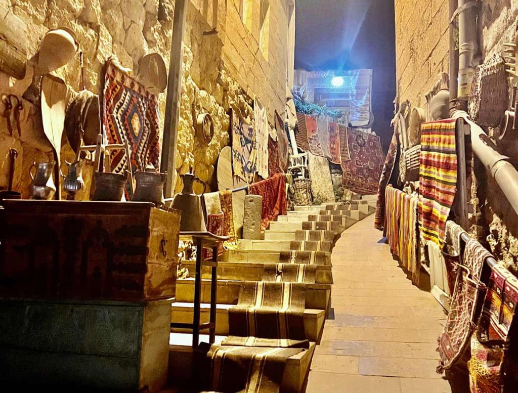 A street in Cappadocia at night, filled with things to purchase and browse.