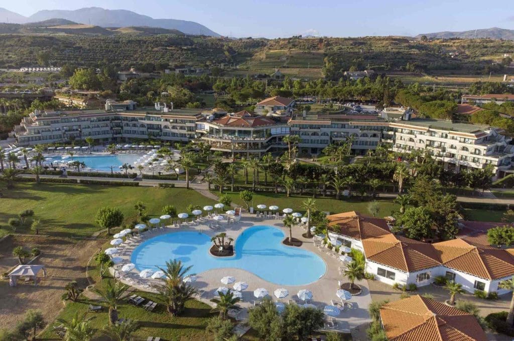 An aerial view of the outdoor pool and grounds of The Grand Palladium Sicilia Resort & Spa, one of the best all-inclusive resorts in Italy with kids.