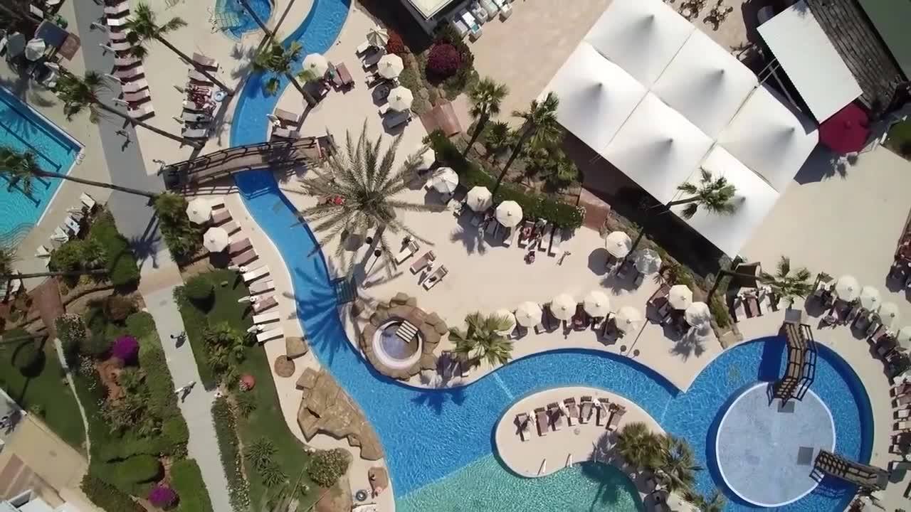 An aerial view of the pool and lazy river area at Adams Beach Hotel.