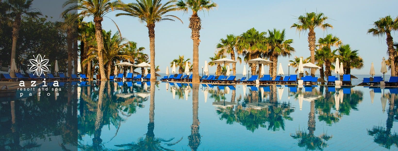 The lovely pool, surrounded by palm trees, at Azia Resort & Spa.