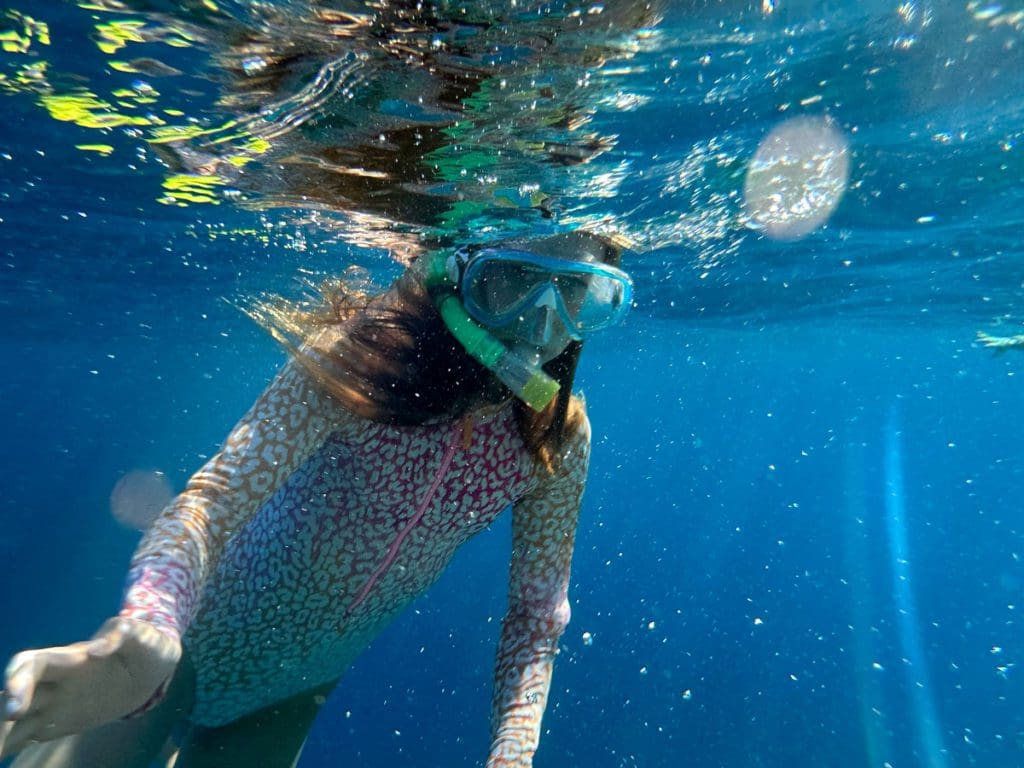 A young girl snorkels in the waters of Sharm el-Sheikh.