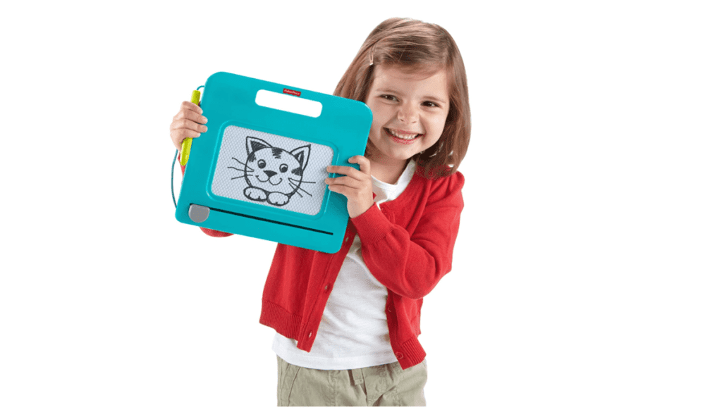 A product shot of a young girl holding the Fisher-Price Travel DoodlePro, one of the best travel toys for young kids.