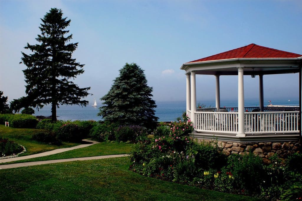 A gazebo and lush grounds at The Colony Hotel, one of the best Maine hotels for families.
