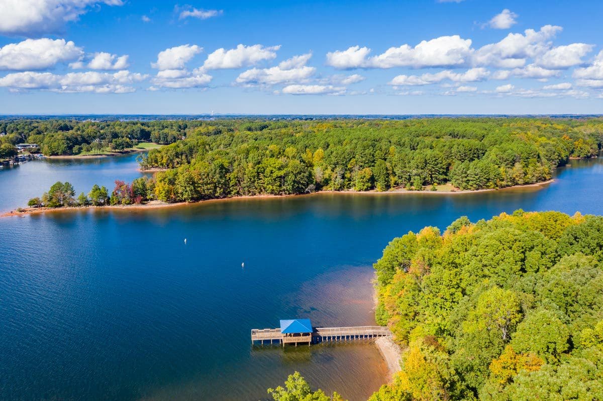 An arial view of Lake Norman, one of the best lakes in North Carolina for a family vacation, on a sunny, summer day.