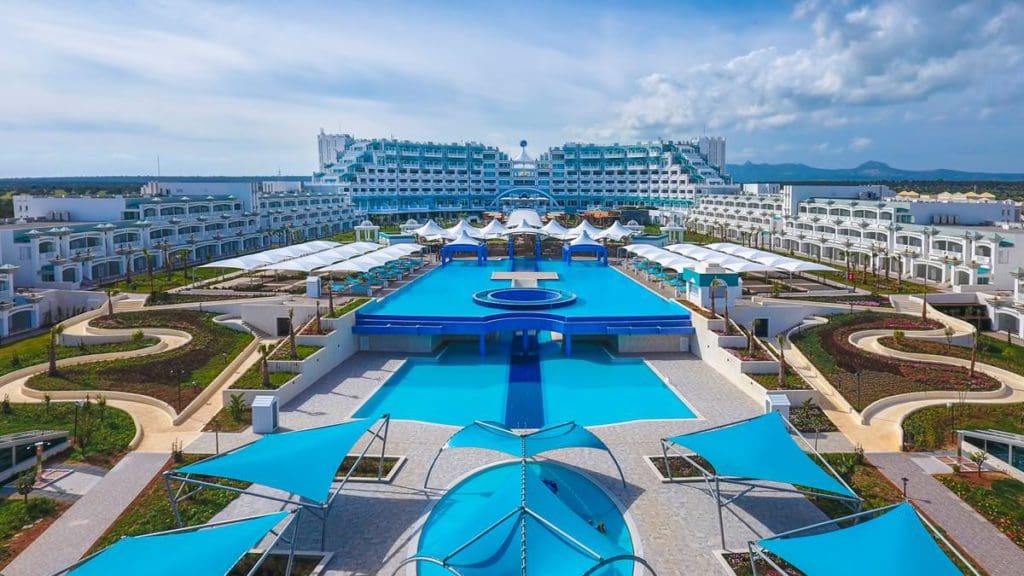 Resort buildings surround the many pools at Limak Cyprus Deluxe Hotel.