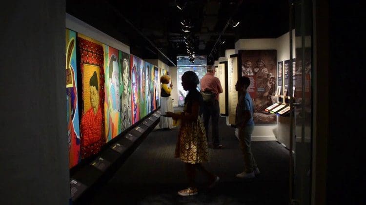 People explore an exhibit hall at American Writers Museum.