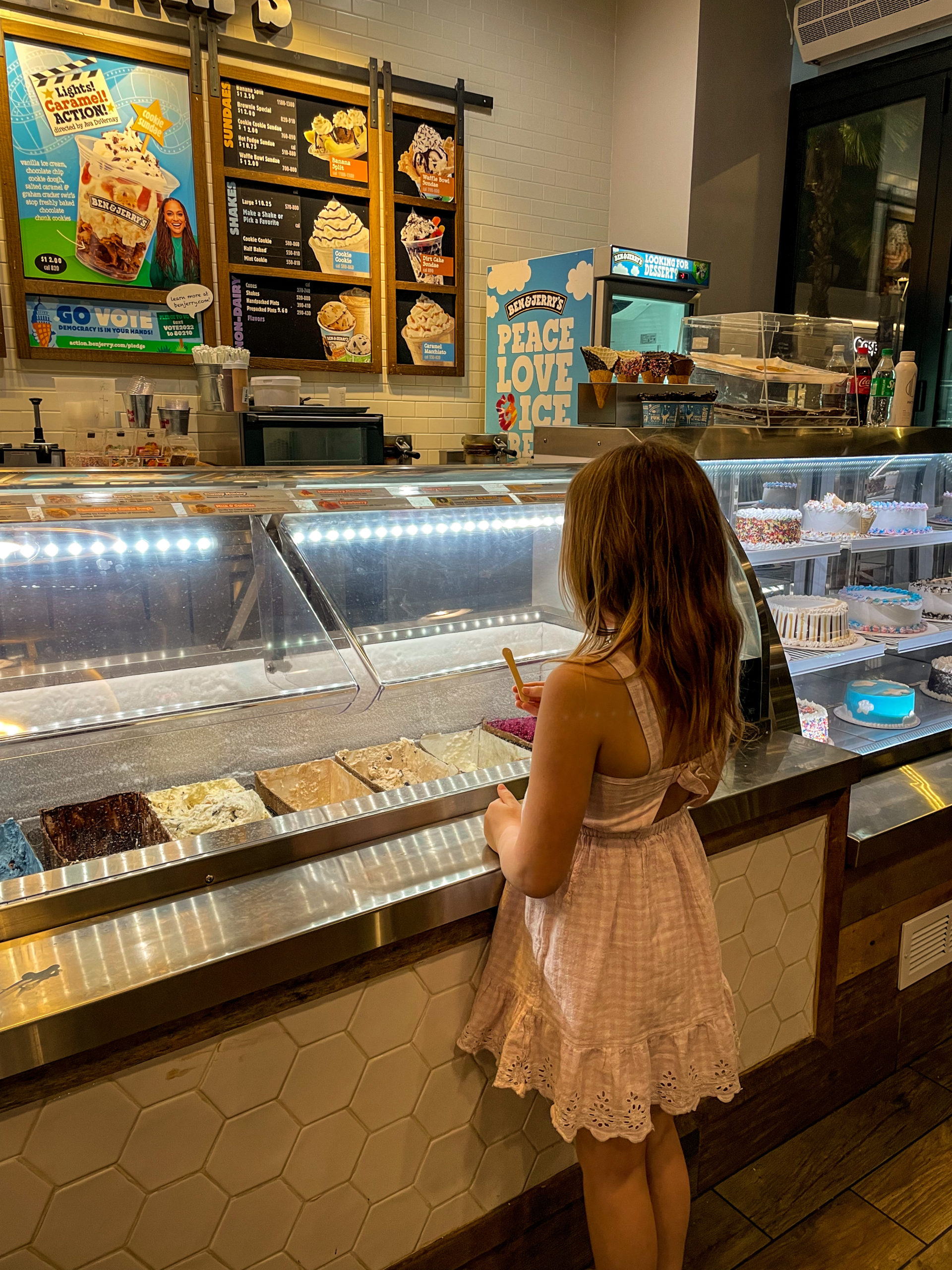 A young girl points to the ice cream she wants from Ben and Jerry's in Tampa Bay.