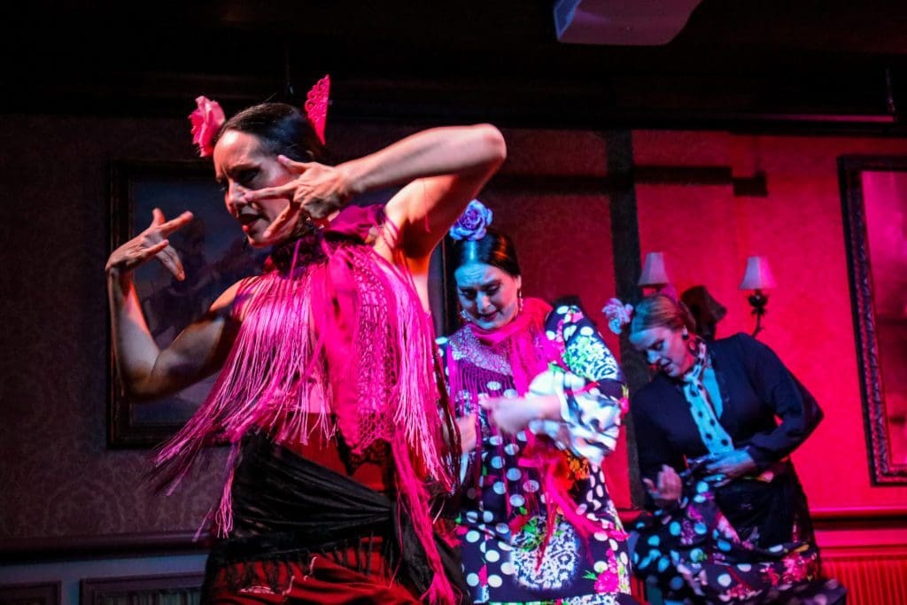 Several dancers perform a flamenco dance on stage at The Columbia Restaurant in Tampa Bay.