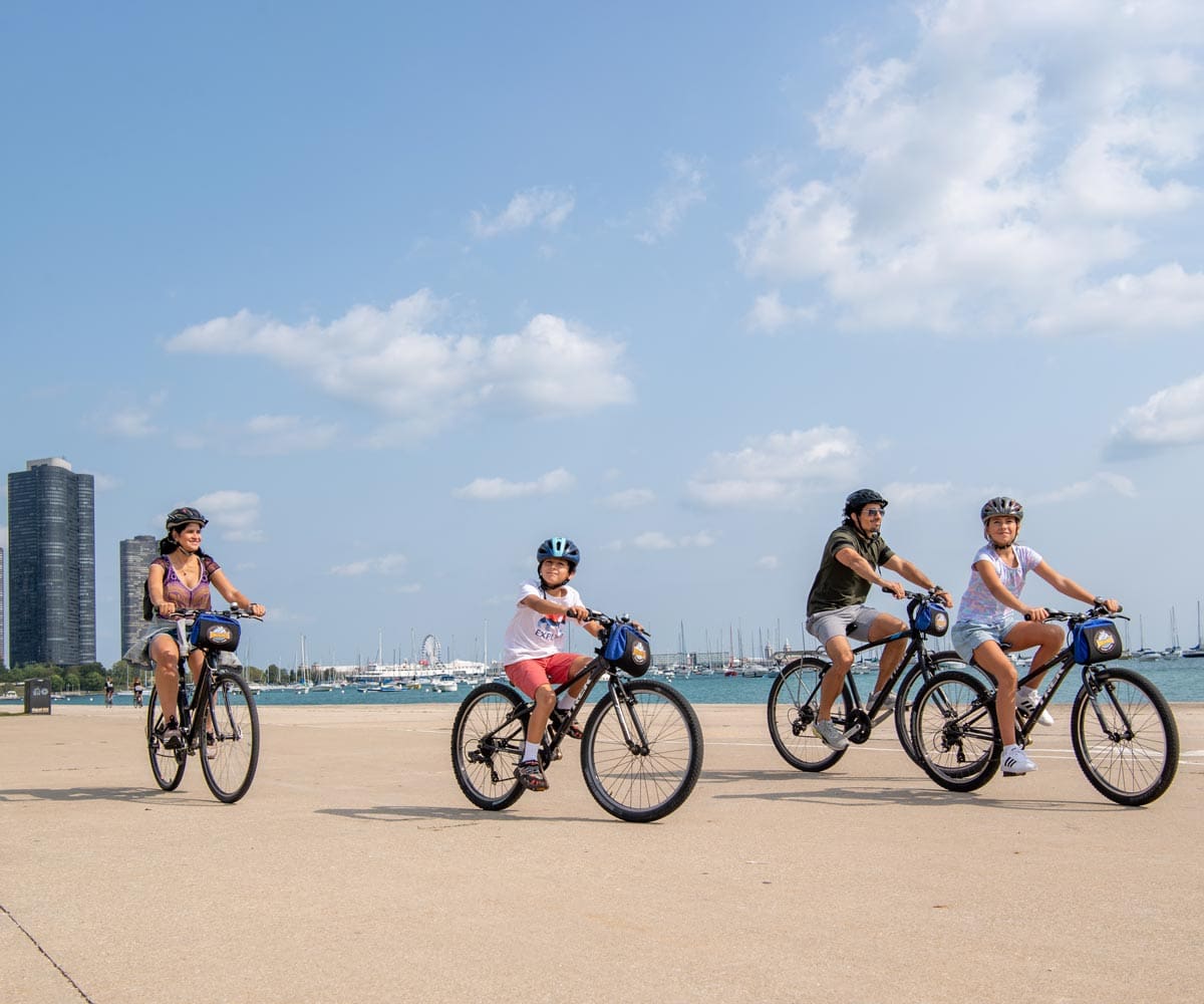 A family of four bikes along the Chicago Lakefront Trail.