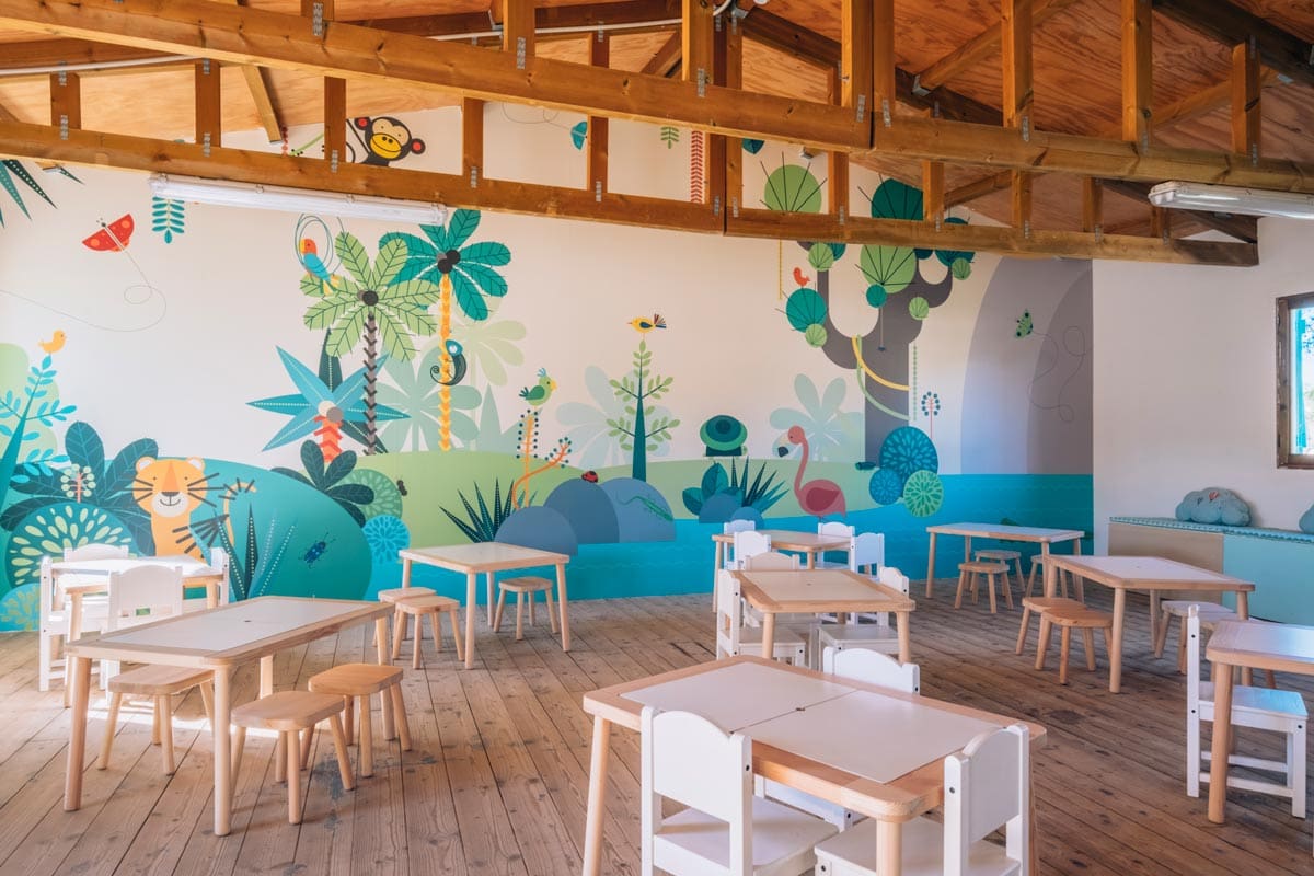 Inside the colorful, well-designed kids' club at Iberostar® Club Cala Barca.